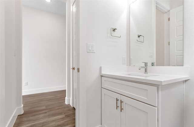 bathroom featuring wood-type flooring and vanity