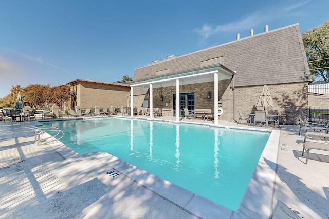 view of pool featuring a patio