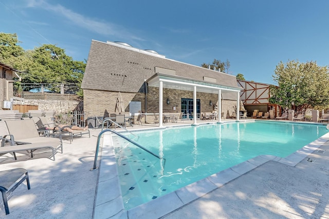 view of pool featuring a patio