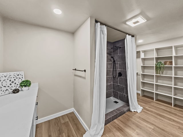 bathroom featuring a shower with curtain and wood-type flooring