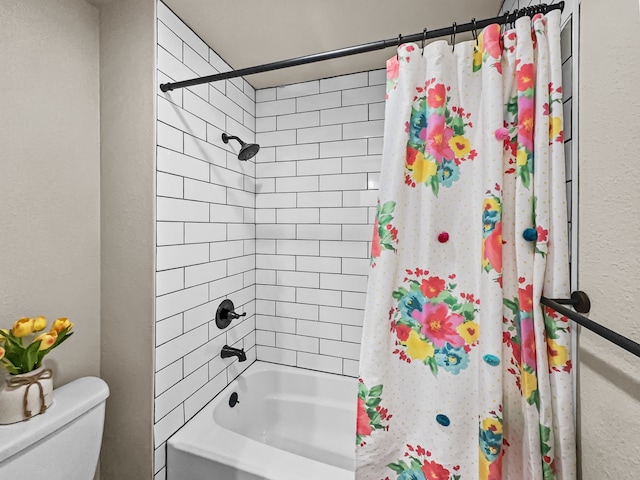 bathroom with shower / tub combo with curtain and toilet