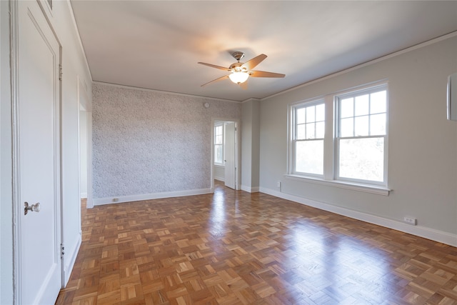 unfurnished room featuring crown molding, ceiling fan, and dark parquet floors