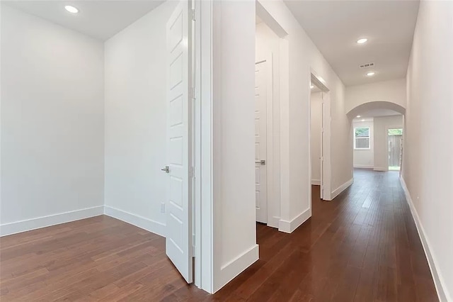 hallway featuring dark wood-type flooring