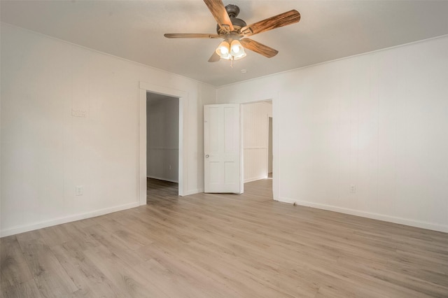 unfurnished room featuring ceiling fan, light hardwood / wood-style flooring, and crown molding