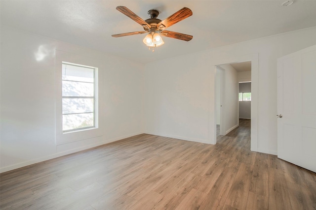 unfurnished room with light hardwood / wood-style floors and ceiling fan