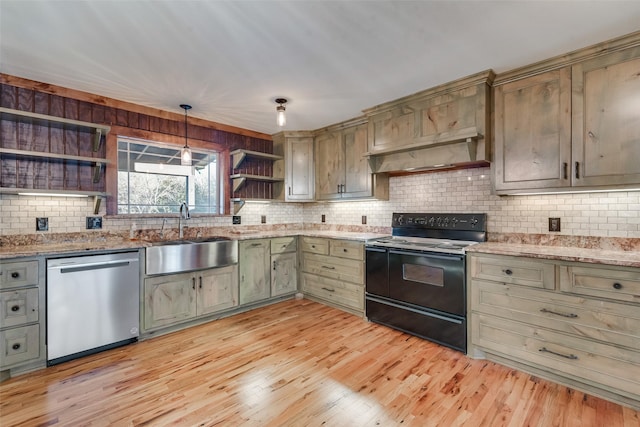 kitchen featuring pendant lighting, sink, stainless steel dishwasher, black electric range, and light hardwood / wood-style flooring