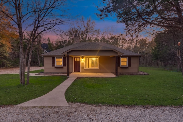 view of front of property with a lawn