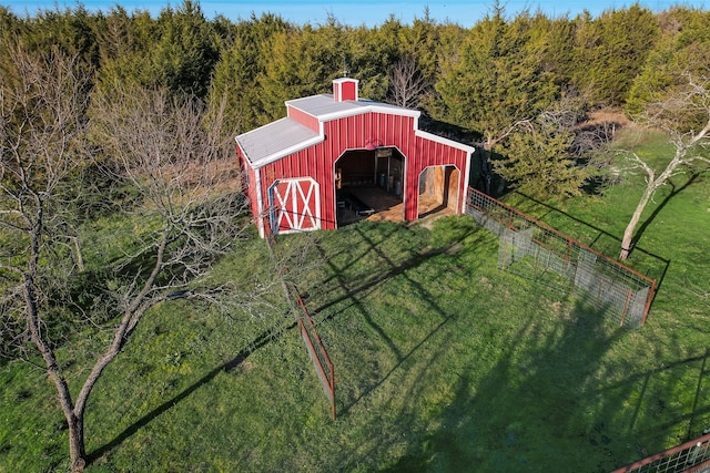 view of outbuilding featuring a lawn