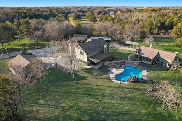 view of swimming pool with a yard