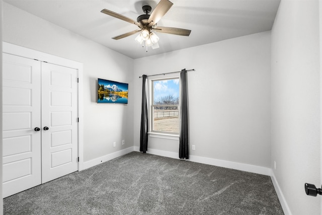 unfurnished bedroom featuring carpet flooring, a closet, and ceiling fan