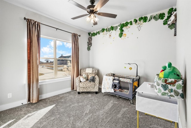 unfurnished room with ceiling fan and carpet floors