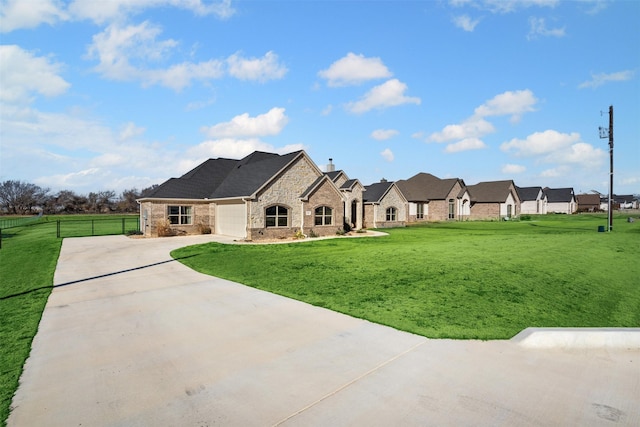 back of house with a garage, fence, a lawn, and concrete driveway