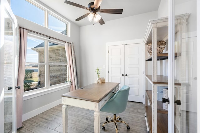 office space featuring ceiling fan and french doors