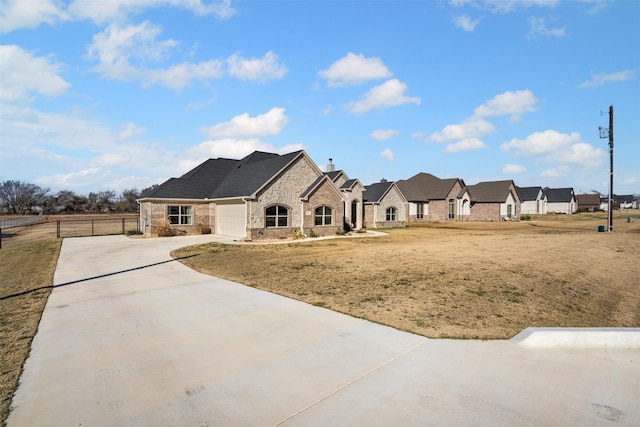 view of front of property with a garage and a front yard