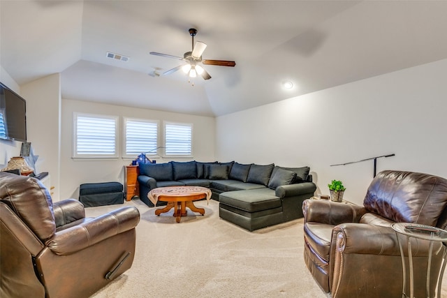 carpeted living room featuring lofted ceiling and ceiling fan