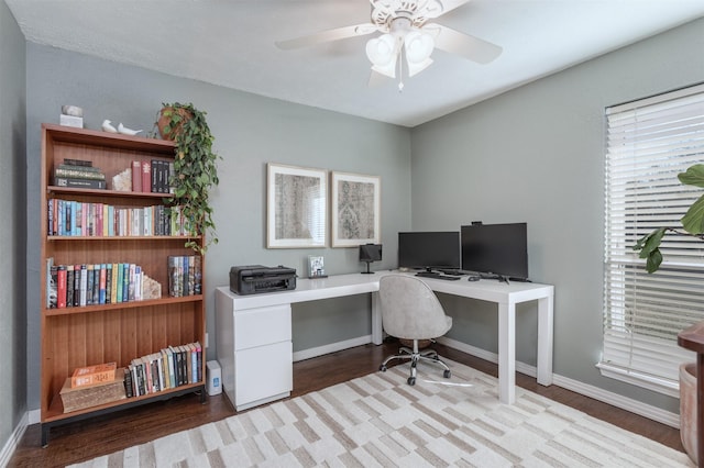 office area with ceiling fan and light hardwood / wood-style floors