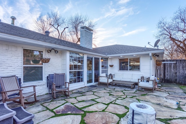 rear view of house featuring a patio