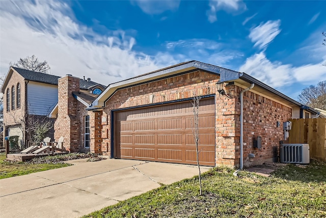 view of home's exterior featuring a garage and cooling unit