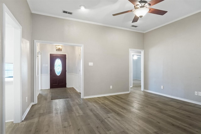 entrance foyer with ceiling fan, dark hardwood / wood-style flooring, and ornamental molding