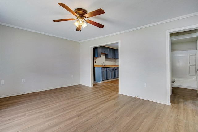 unfurnished living room featuring ceiling fan, light hardwood / wood-style flooring, and ornamental molding