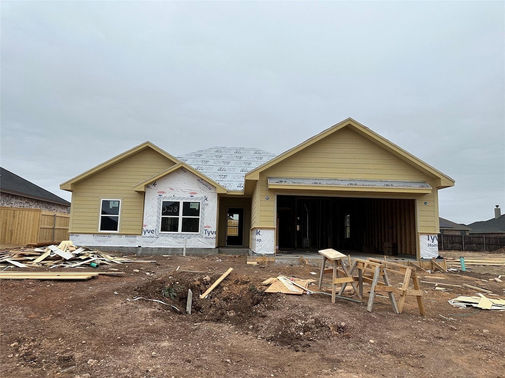 unfinished property with a garage