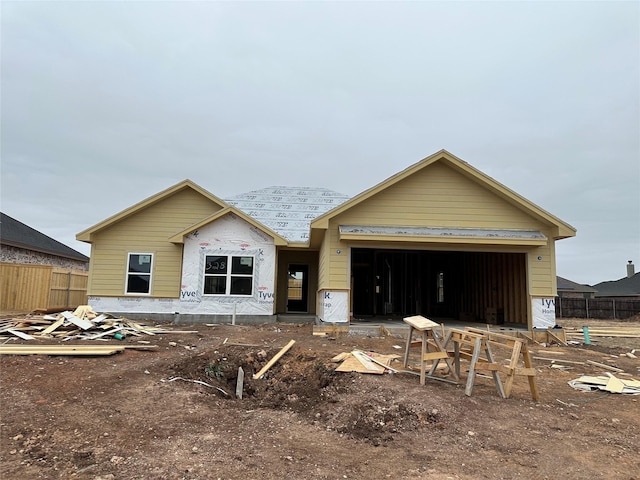 unfinished property with a garage