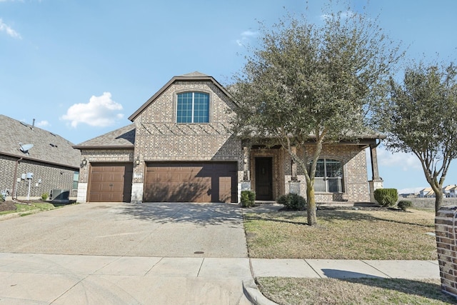 view of front of home featuring concrete driveway, brick siding, and a shingled roof