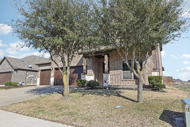 view of front facade with a garage, a front yard, concrete driveway, and brick siding