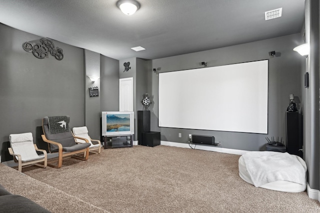 home theater with carpet flooring, visible vents, and baseboards