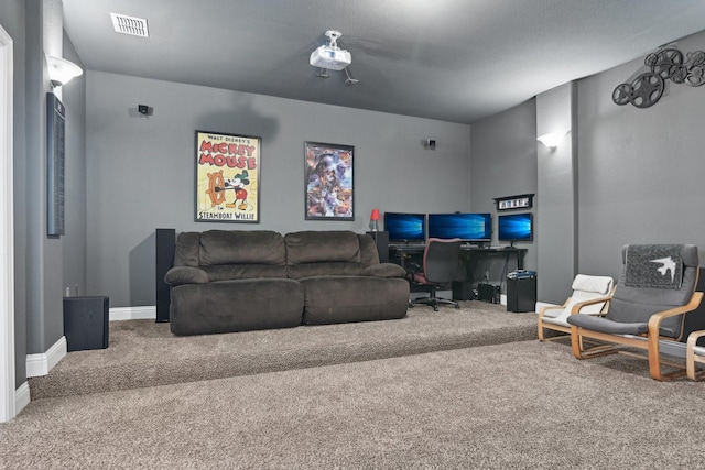 cinema featuring carpet floors, visible vents, and baseboards