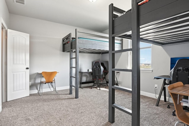 carpeted bedroom featuring baseboards