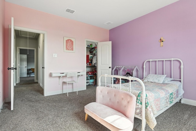 bedroom featuring visible vents, dark carpet, attic access, and baseboards