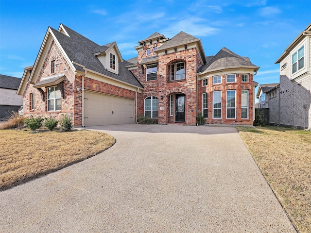 view of front of house with a front lawn and a garage