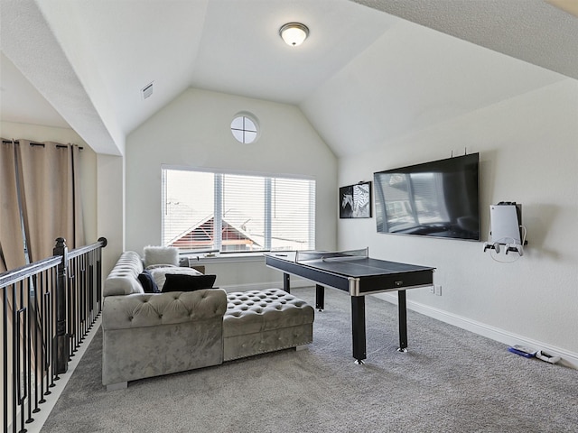 recreation room with lofted ceiling and carpet