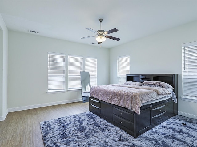 bedroom featuring ceiling fan and light hardwood / wood-style flooring