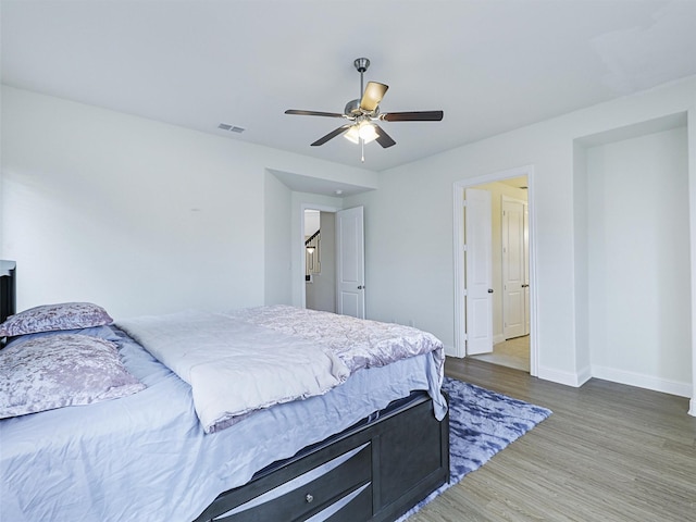 bedroom featuring ceiling fan and wood-type flooring