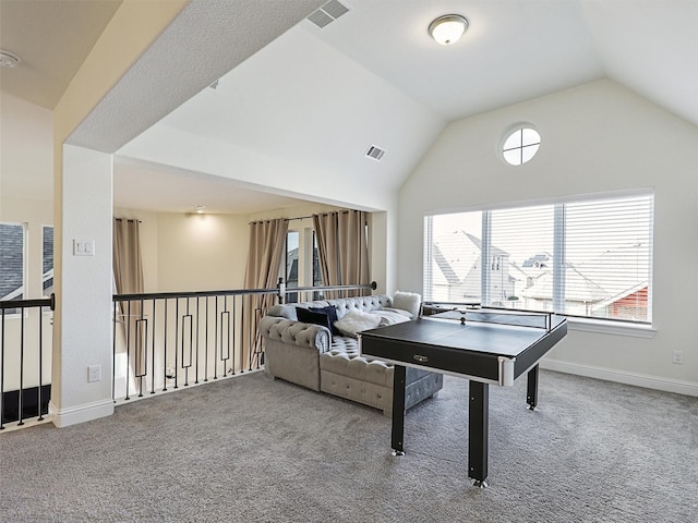 rec room featuring carpet flooring and vaulted ceiling