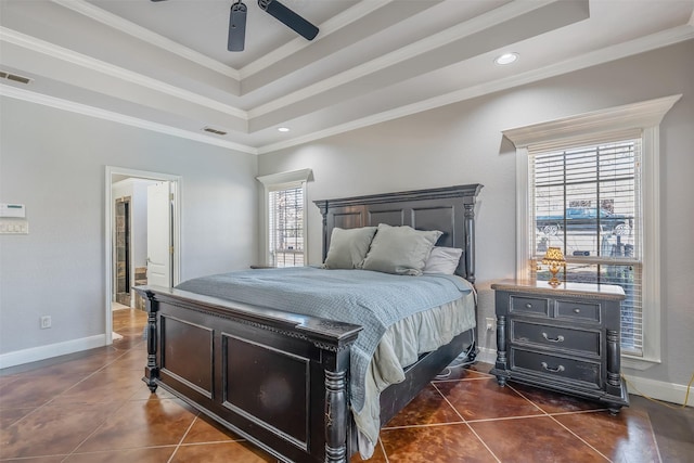 bedroom with ceiling fan, dark tile patterned floors, crown molding, and multiple windows