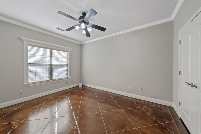 tiled empty room featuring ceiling fan and crown molding