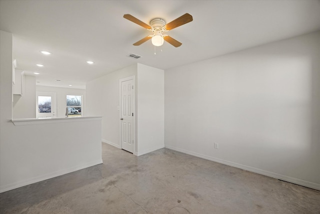 unfurnished room with ceiling fan