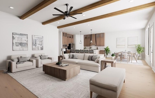 living room with beam ceiling, ceiling fan, and light wood-type flooring