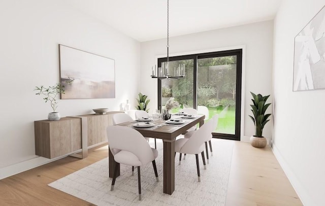 dining space featuring a chandelier and light wood-type flooring