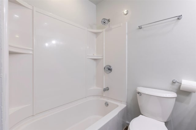 bathroom with bathtub / shower combination and toilet