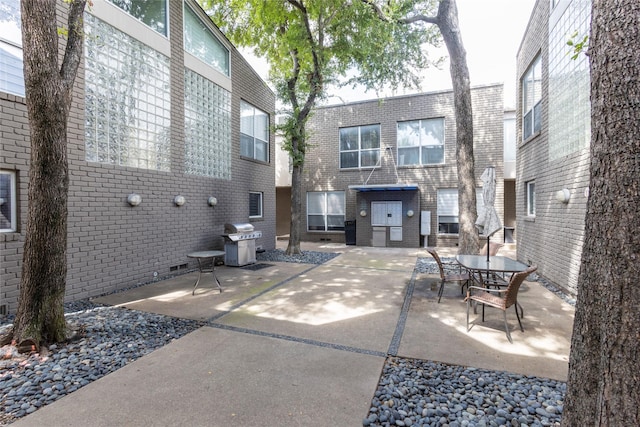 view of patio featuring a grill