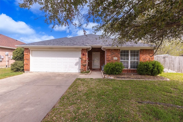 ranch-style house featuring a garage and a front lawn