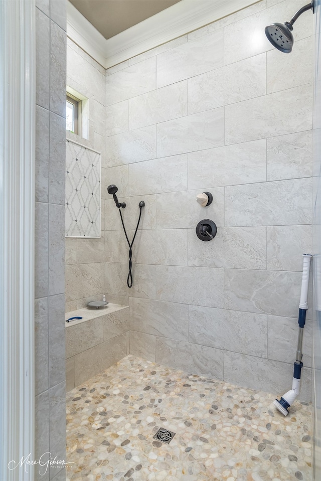 bathroom with a tile shower