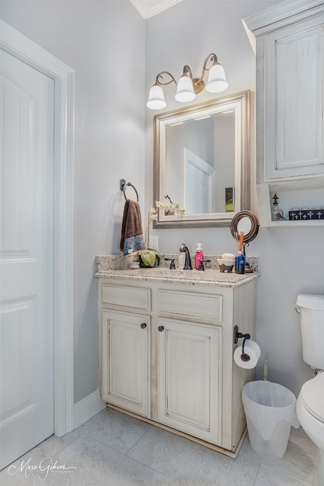 bathroom with vanity and toilet