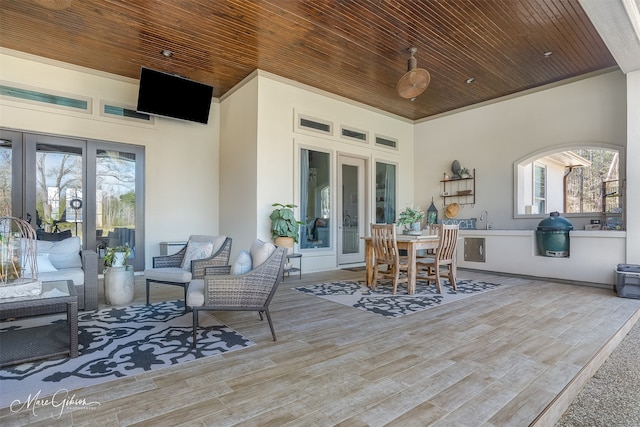 view of patio with sink, outdoor lounge area, and ceiling fan