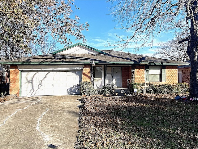 ranch-style house featuring a garage