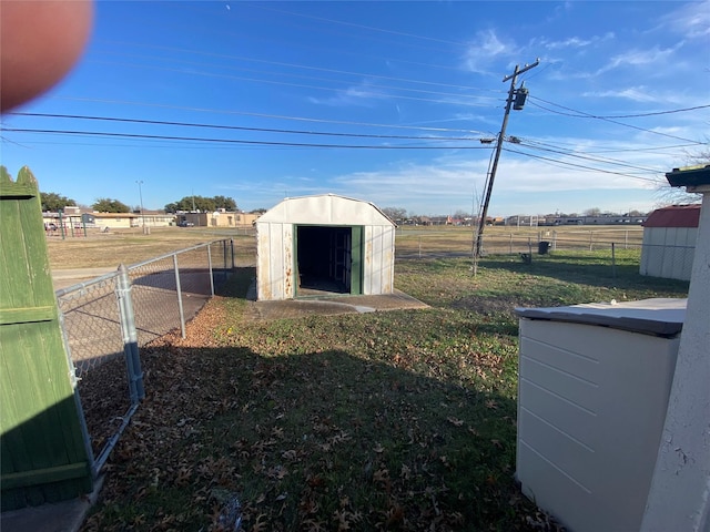 view of outdoor structure featuring a lawn